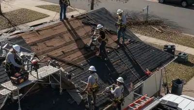 Storm damage restoration crew in Fremont, CA removing water after rain intrusion